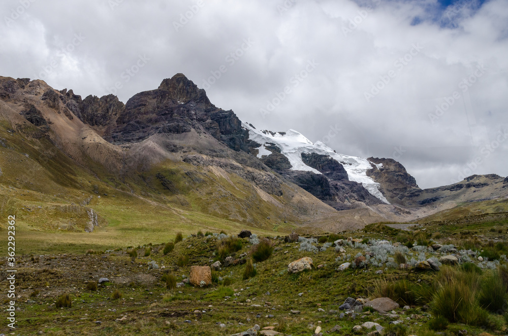 Fototapeta premium View of the valley landscape in Huascaran with green nature and snow mountains