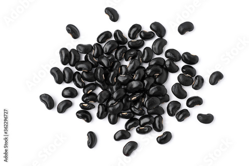 Pile of black beans ( Urad dal, black gram, vigna mungo ) isolated on white background . Overhead view. Flat lay. photo