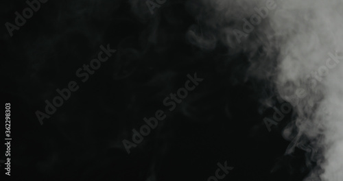 water mist over black background