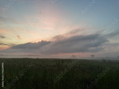 Sunset in the field, fog 