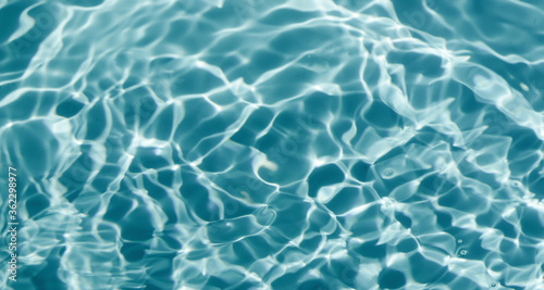 Blue water in the pool. Beautiful stains  abstract water background.