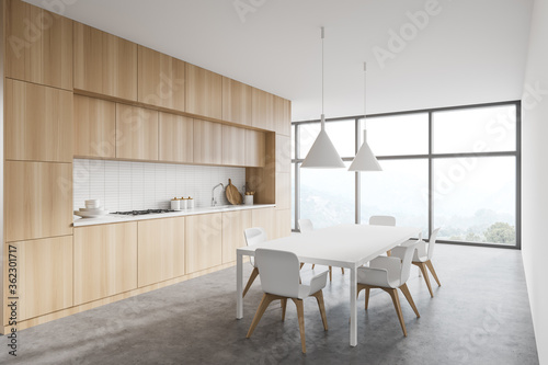 White and wooden kitchen corner with table © ImageFlow