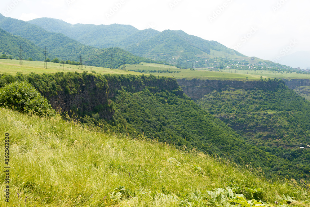 Fototapeta premium Hiking trail leading from Haghpat Monastery to Sanahin Monastery. a famous landscape in Akner village, Alaverdi, Lori, Armenia.