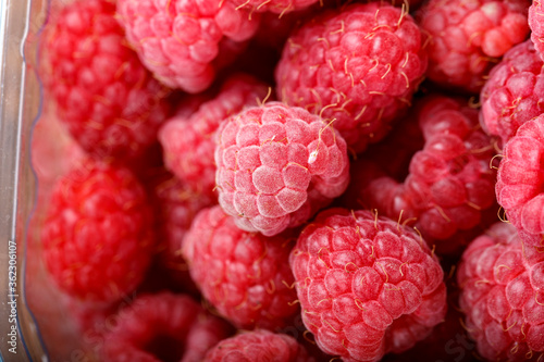 Fresh raspberries in store packaging.