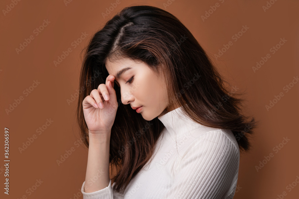 Beautiful asian woman with a beautiful face . Side view She shows her stress. Beautiful asian woman with a beautiful face . Side view She shows her stress.