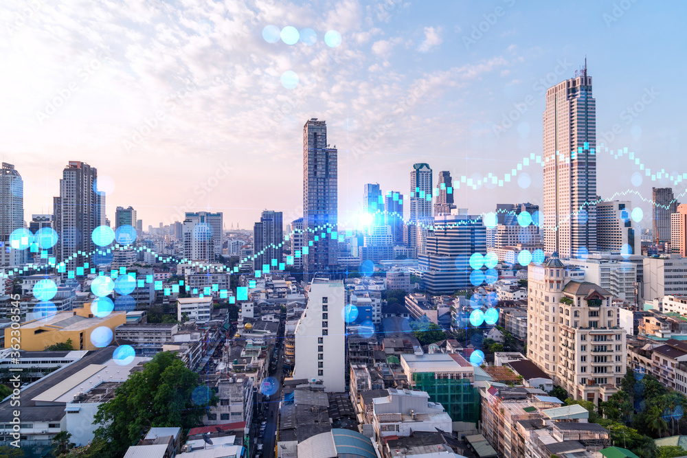 Obraz premium Glowing FOREX graph hologram, aerial panoramic cityscape of Bangkok at sunset. Stock and bond trading in Asia. The concept of fund management. Double exposure.