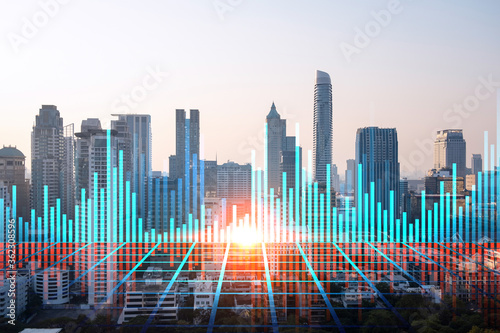 Glowing FOREX graph hologram  aerial panoramic cityscape of Bangkok at sunset. Stock and bond trading in Asia. The concept of fund management. Double exposure.