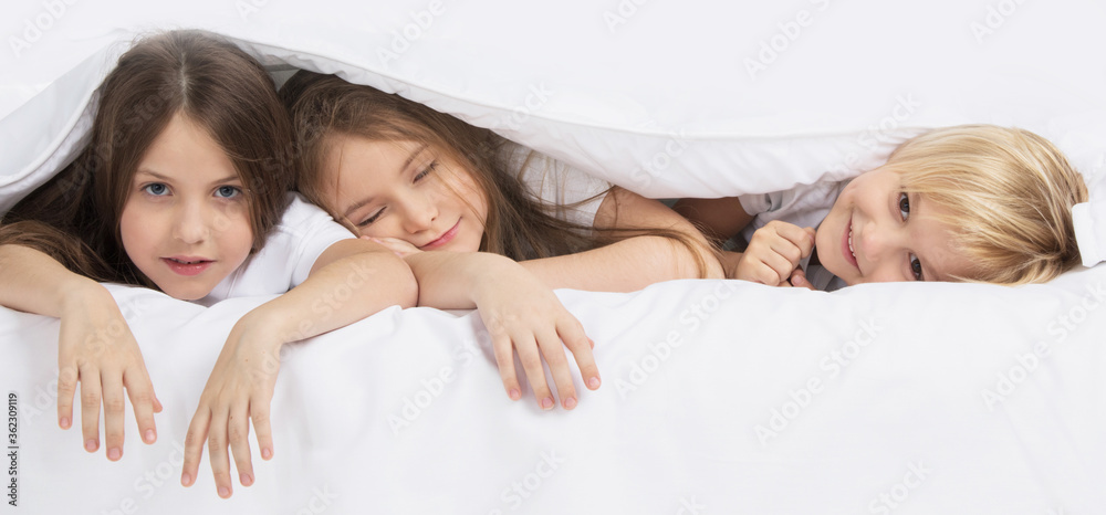 Children waking up in bed Children waking up in bed