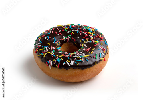 Donut with a chocolate coating and decorated with colored sprinkles
