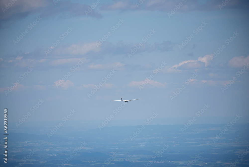 Glider plane flying in the sky. Two seat glider just before landing Glider plane flying in the sky. Two seat glider just before landing