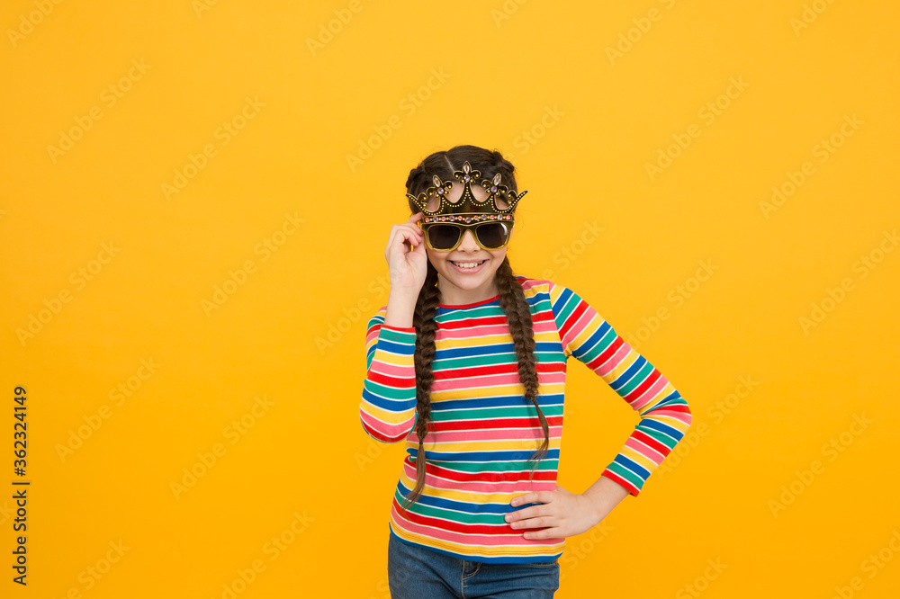 Self care isnt selfish. Happy child wear prop crown and glasses. Beauty look of small girl. Party look. Casual fashion style. Egoist look. I want you to only look at me, copy space Self care isnt selfish. Happy child wear prop crown and glasses. Beauty look of small girl. Party look. Casual fashion style. Egoist look. I want you to only look at me, copy space