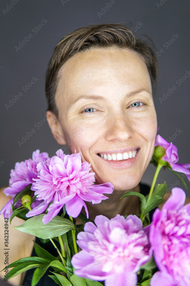 Beautiful woman portrait with peony, natural beauty, freshness, tender Beautiful woman portrait with peony, natural beauty, freshness, tender