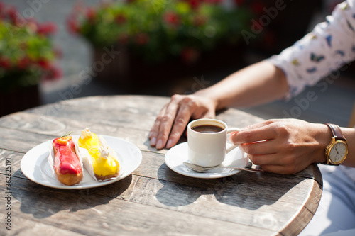 mug of delicious fragrant coffee on the table in the hands