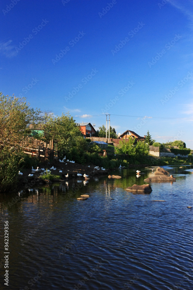 Fototapeta premium Large stone boulders lie in the river
