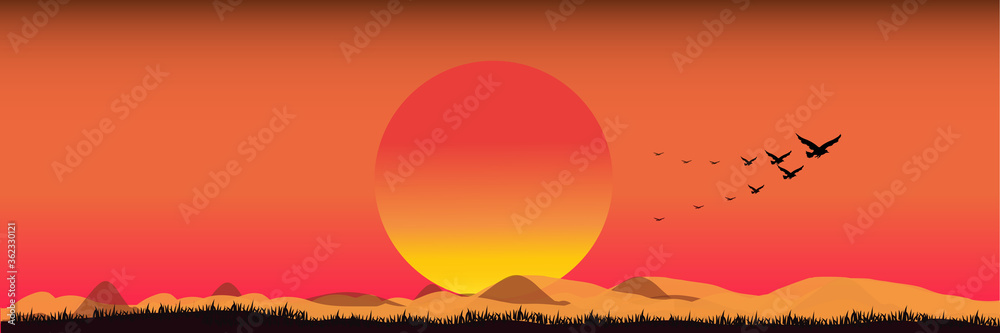 Safari theme.Silhouettes of birds flying in the orange sky At sunset, sunset time with Birds in the sky.The bird flew home.End of mission concept.
