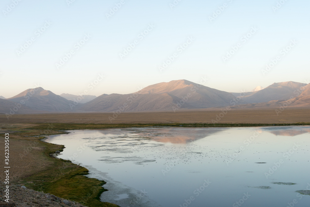 Morning Landscape of Bulunkul Lake in Gorno-Badakhshan, Tajikistan. It is located in the World Heritage Site Tajik National Park (Mountains of the Pamirs).