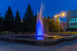 Illuminated fountain in the square in front of the municipality. Abakan. Khakassia.