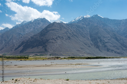 Afghanistan and Panj river at Wakhan Valley View from Zugvand Village, Gorno-Badakhshan, Tajikistan. It is located in the Tajikistan and Afghanistan border.