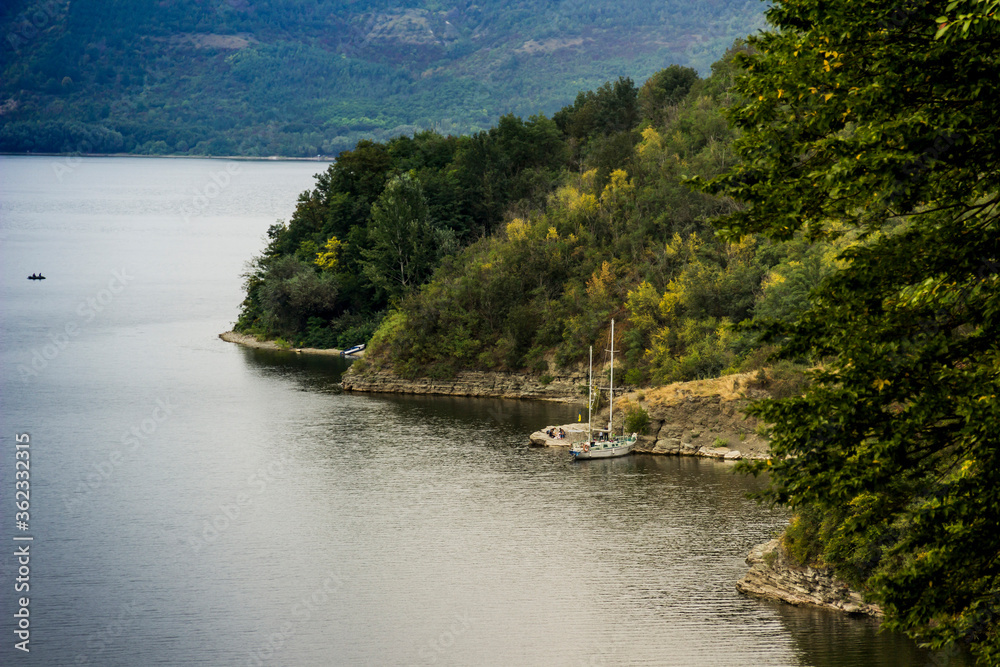 Fototapeta premium yacht in Bakota bay (Dnistrovske reservoir), Dnister river, Podilski tovtry National park, Khmelnitskiy region of Western Ukraine