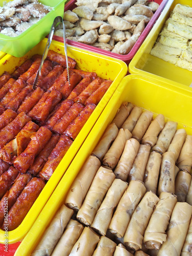 Malaysian cakes are on display for sale on the table. Sort by type to make it easier for customers to buy.
 photo