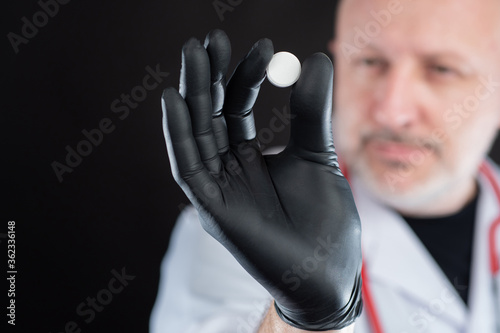 Medicine. A pill in the doc...
