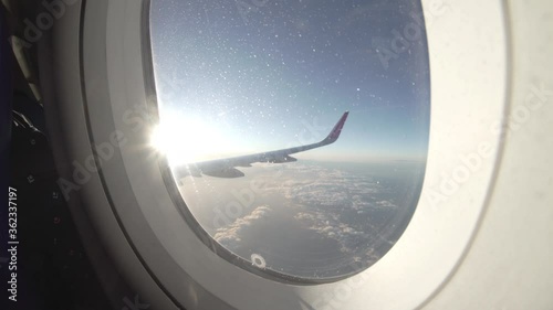 Wallpaper Mural Airplane flight. Wing of an airplane flying above the clouds with sunset sky. View from the window of the plane. Airplane, Aircraft. Aerial view from passenger plane Traveling by air. 4K UHD video Torontodigital.ca