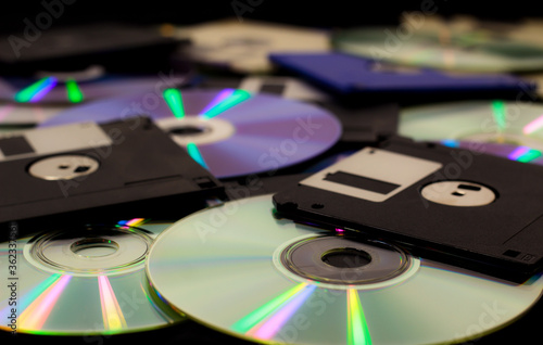 Plakat Stack of CDs and Diskettes spread over ground