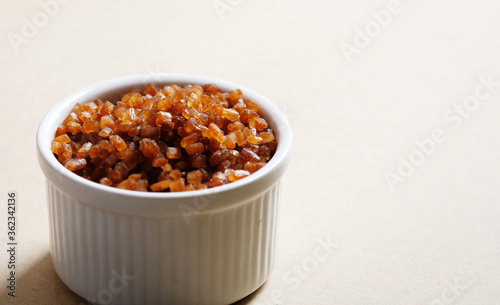 Bowl of Crystal Sugar. Brown cane sugar.