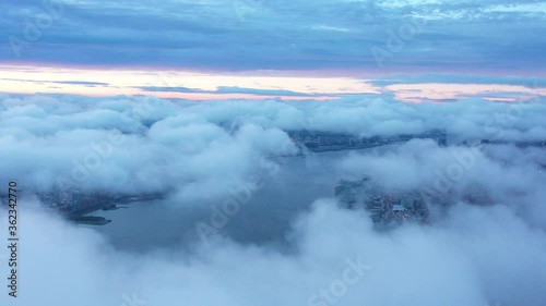 4K RAW Footage in D-log: Aerial view of New York skyline from above the cloud, New York City Skyline / Cityscape at sunset. 