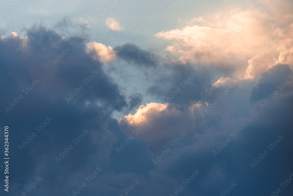 Beautiful rain clouds close-up before sunset. Cumulus clouds close up