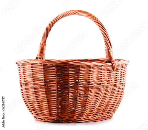 Empty wicker basket isolated on white photo