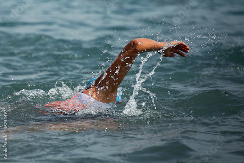 Swim triathlete woman swimming freestyle crawl in ocean © pavel1964