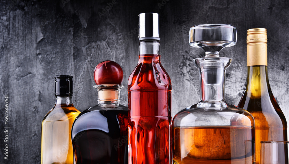 Carafe and bottles of assorted alcoholic beverages. Carafe and bottles of assorted alcoholic beverages.