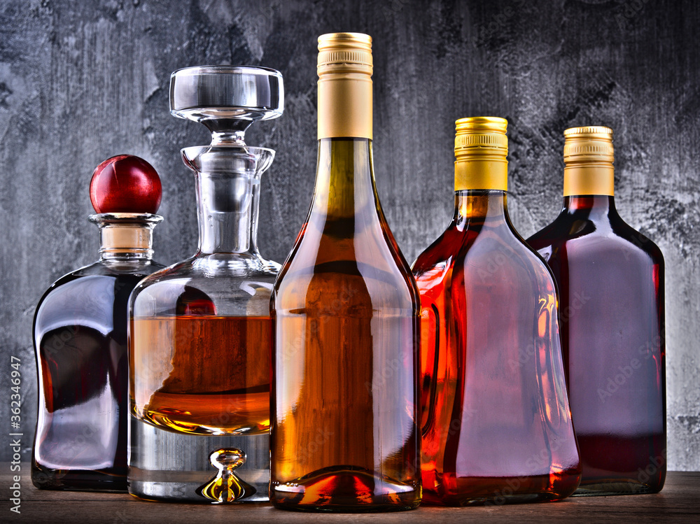 Carafe and bottles of assorted alcoholic beverages. Carafe and bottles of assorted alcoholic beverages.