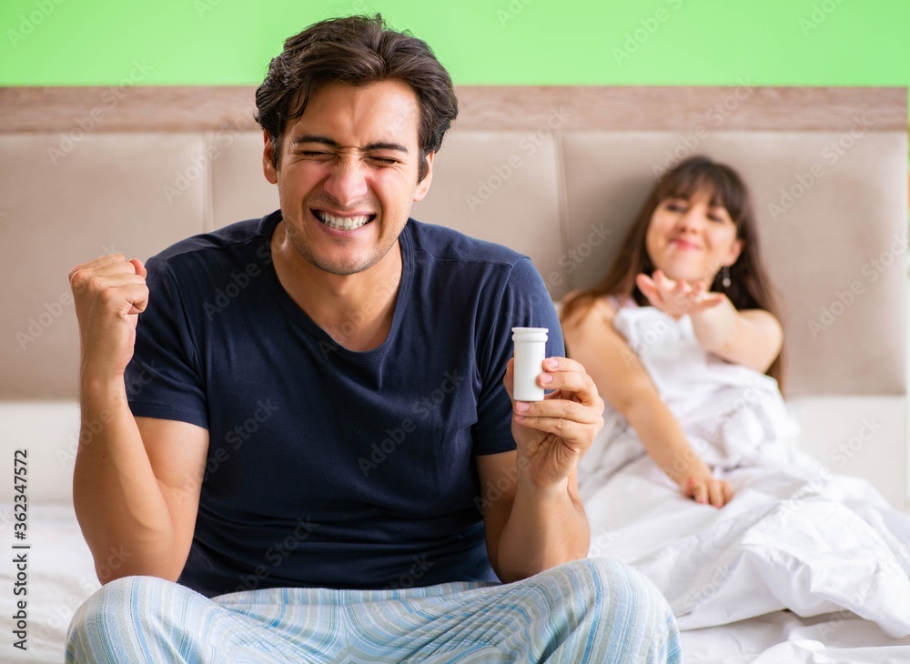 Man using pills for woman satisfaction