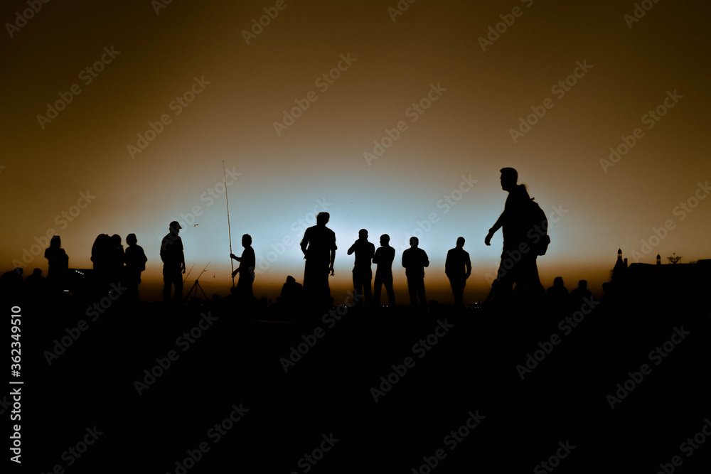 group of people at sunset