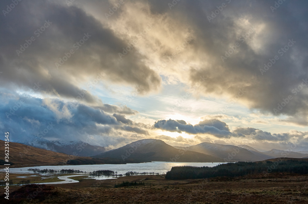 Dramatic angry winter sky with mountains and Loch Tulla in the background Scotland Scottish highlands 