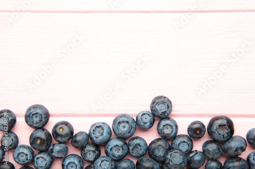 Tasty blueberries on pink background. Blueberries are antioxidant organic superfood.