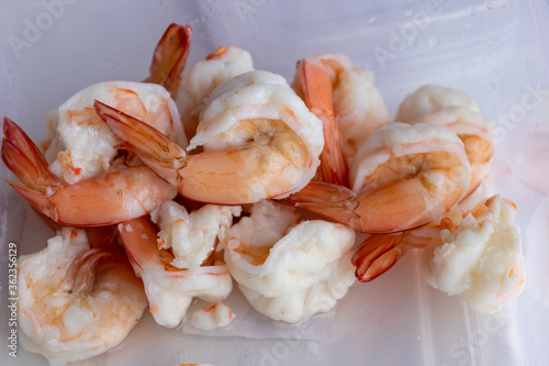 cooked and peeled shrimps on white plate