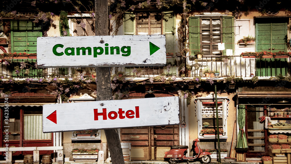 Street Sign to Camping versus Hotel