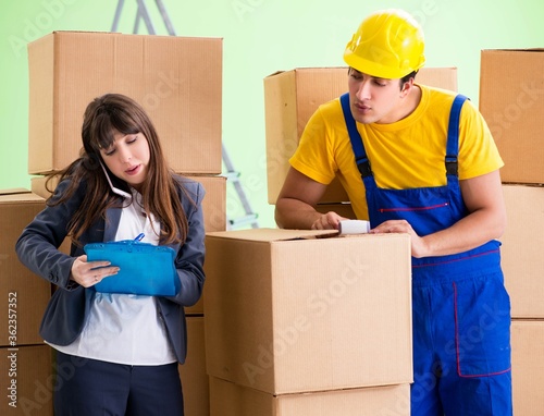 Woman boss and man contractor working with boxes delivery © Elnur