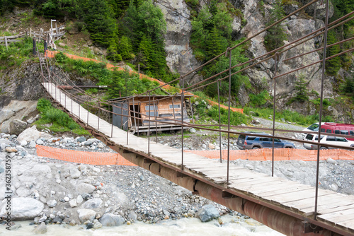 Bridge to Chalaadi glacier track. a famous landscape in Mestiachala valley, Mestia, Samegrelo-Zemo Svaneti, Georgia. photo