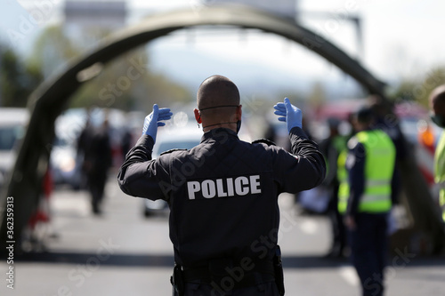 Policeman navigate cars photo