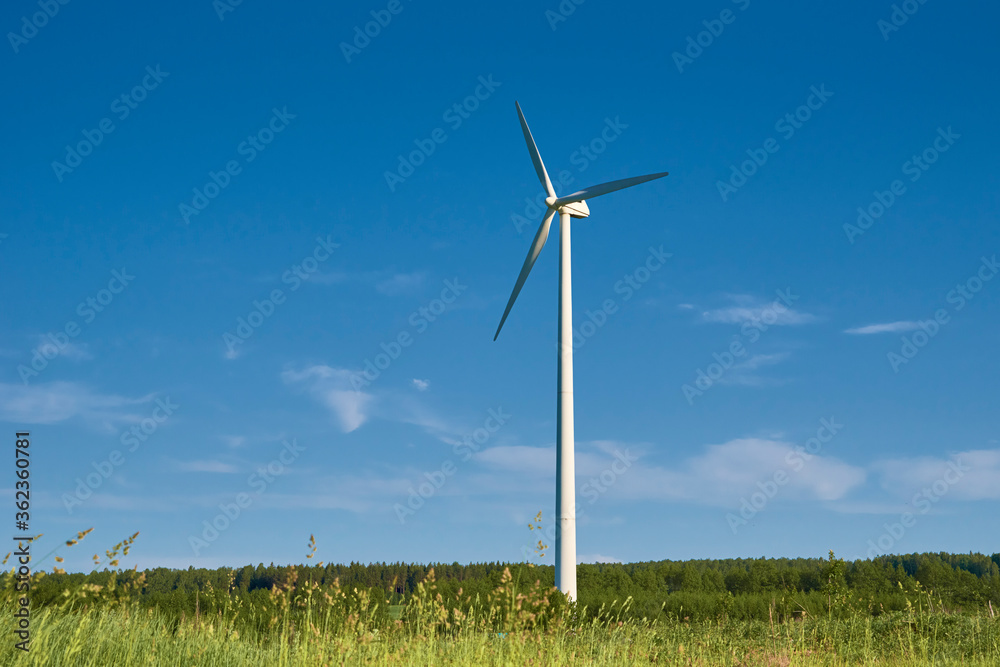 Wind turbine in the field. Wind power energy concept Wind turbine in the field. Wind power energy concept