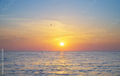 Sun and sea sunset background.