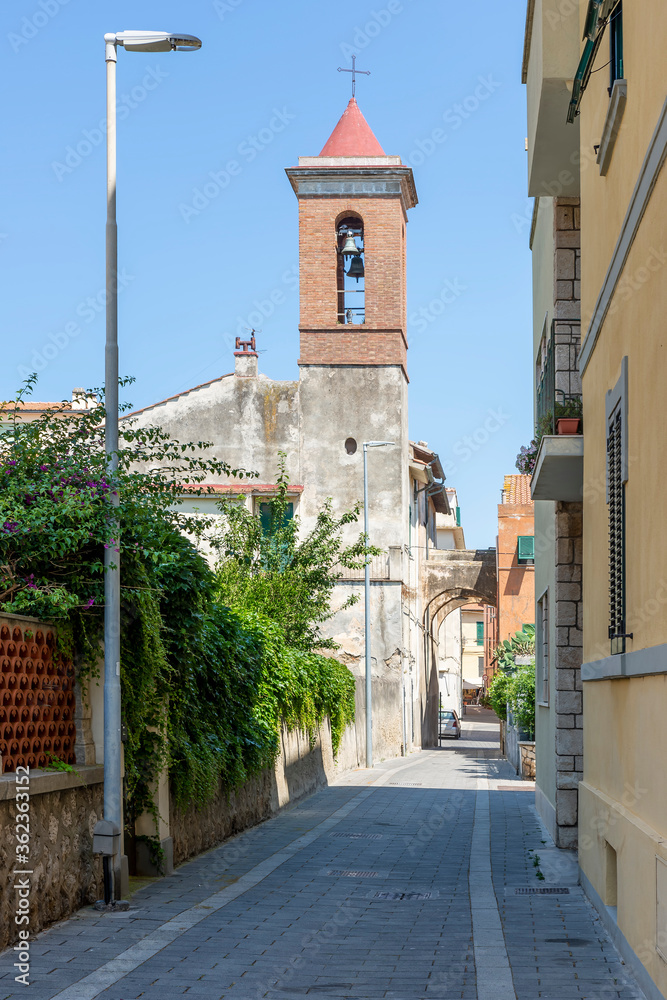Vertical view of Via Pisacane in the historic center of Orbetello, Grosseto, Italy, on a sunny day