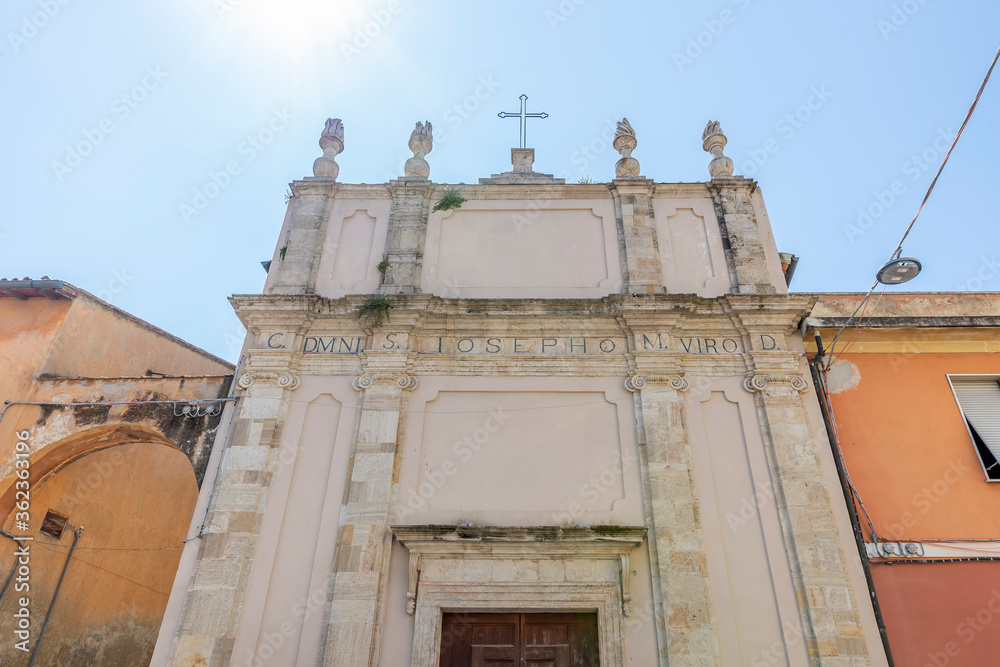 Fototapeta premium The facade of the ancient Church of San Giuseppe in the historic center of Orbetello, Grosseto, Italy, on a sunny day