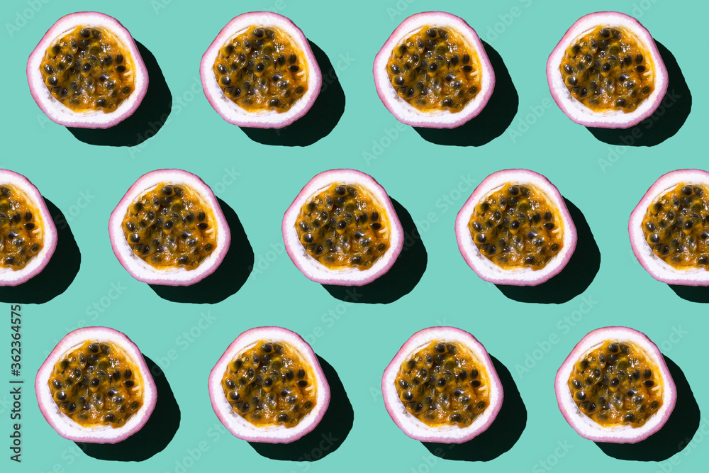Colorful fruit pattern of fresh passion fruit on pastel green background. Colorful fruit pattern of fresh passion fruit on pastel green background.