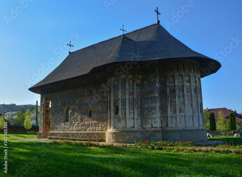 Obraz na płótnie HUMORULUI MONASTERY, BUCOVINA, ROMANIA, EUROPE, SPRING 2018. Orthodox monastery. Moldovan architectural style. Outdoor paintings, frescoes and portraits of saints with Byzantine influence. w salonie
