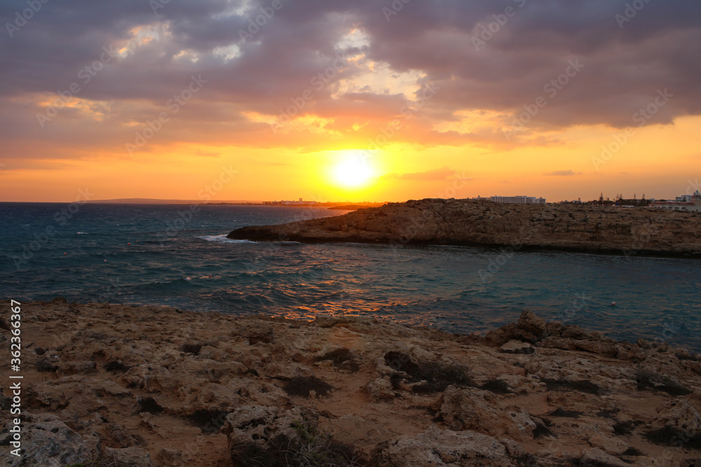 Sunset on the Mediterranean sea. Rocky shore. Ayia Napa. Cyprus.